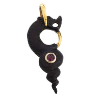 Ebony gold and ruby serpent pendant