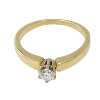 Diamond solitaire ring in yellow and white gold