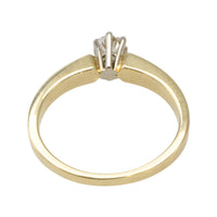 Diamond solitaire ring in yellow and white gold