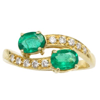 Vintage emerald and diamond crossover ring