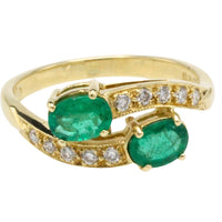 Vintage emerald and diamond crossover ring