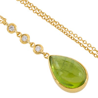 Peridot and diamnd pendant in 18 carat gold
