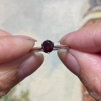 Garnet solitaire ring in white gold