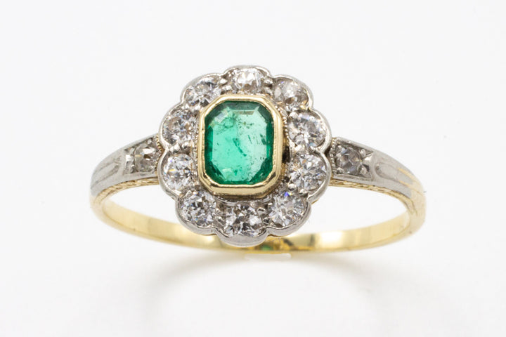platinum ring with emerald and diamonds