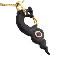 Ebony gold and ruby serpent pendant