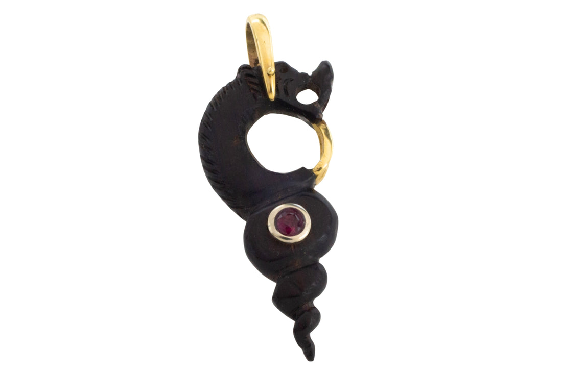 Ebony gold and ruby serpent pendant