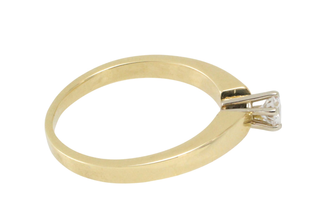 Diamond solitaire ring in yellow and white gold