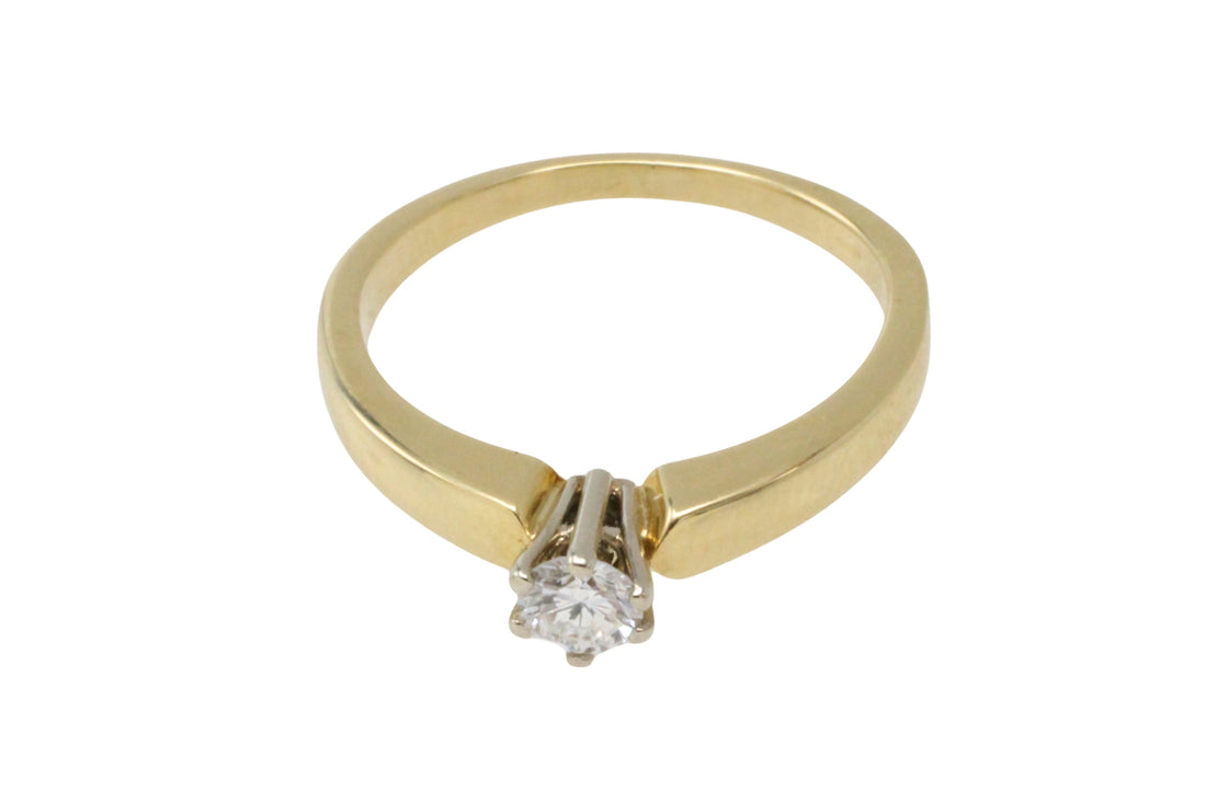 Diamond solitaire ring in yellow and white gold