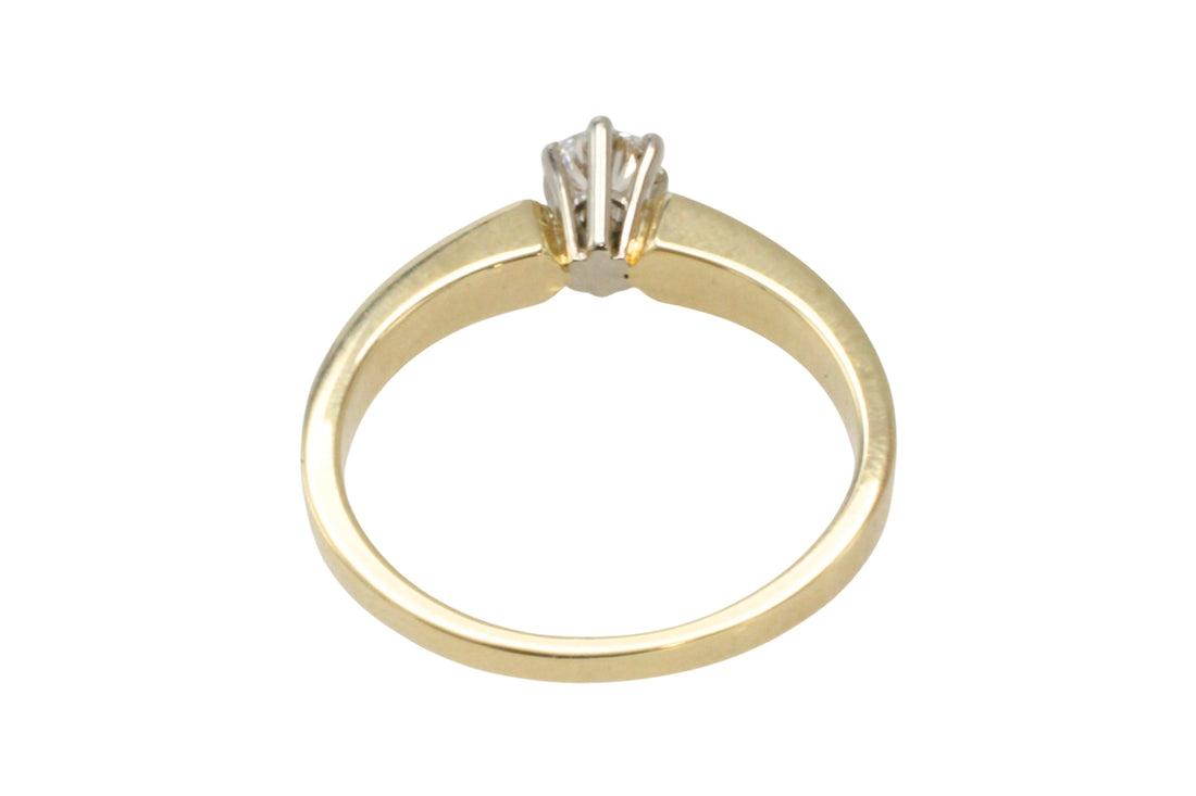 Diamond solitaire ring in yellow and white gold