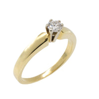 Diamond solitaire ring in yellow and white gold
