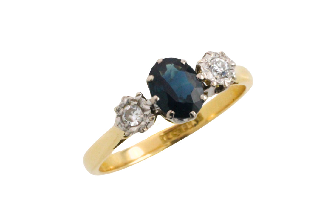 Vintage three stone sapphire and diamond ring