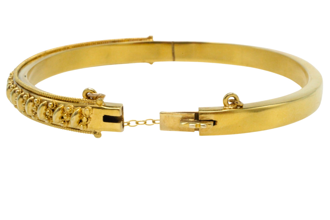 Vintage hinged bracelet in 14 carat gold