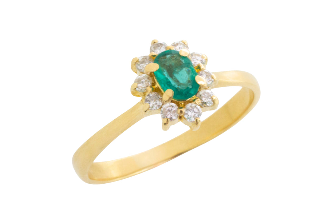 Emerald and diamond cluster ring in 18 carat gold