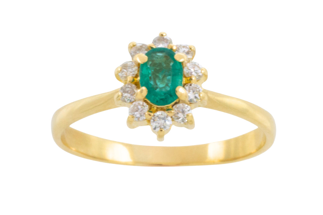 Emerald and diamond cluster ring in 18 carat gold