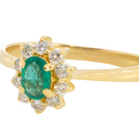 Emerald and diamond cluster ring in 18 carat gold