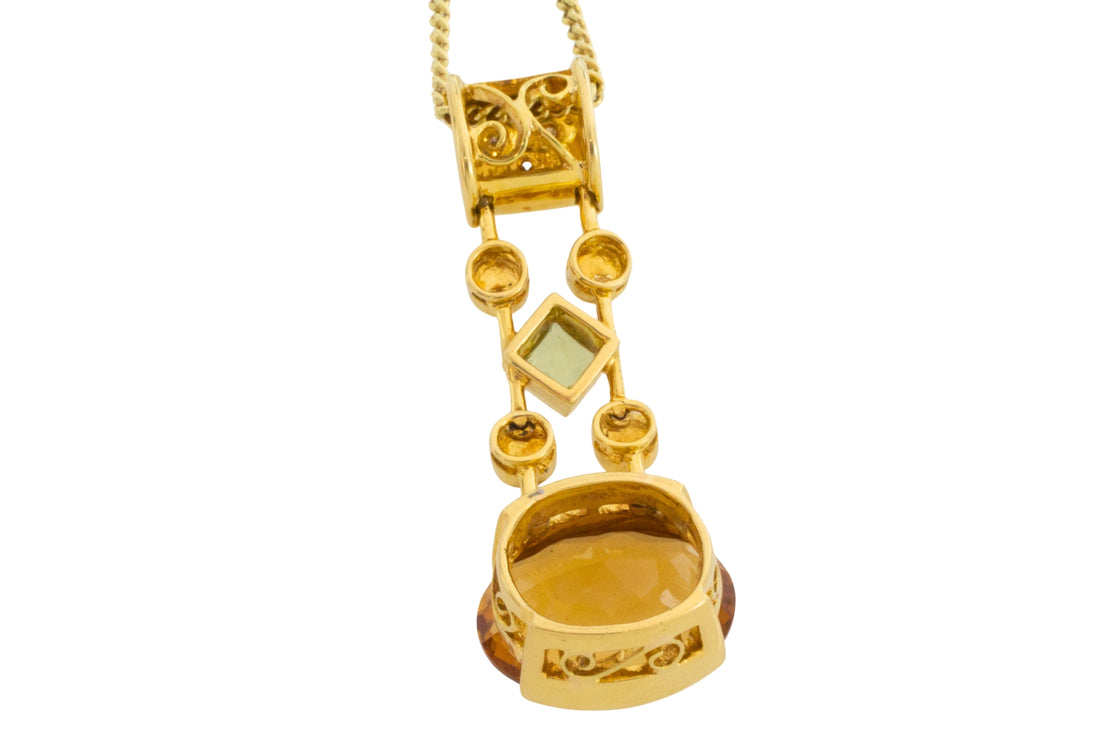 Gold pendant with citrine amethyst peridot and diamonds