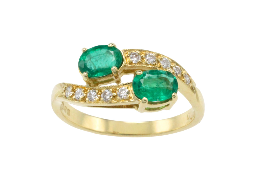 Vintage emerald and diamond crossover ring