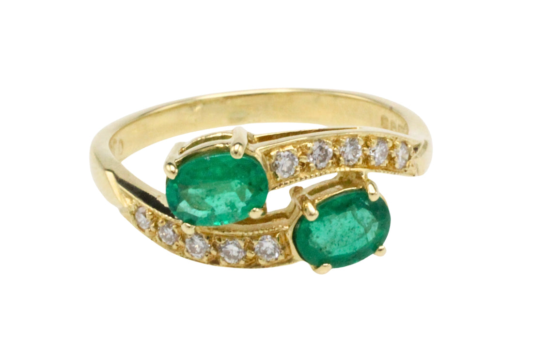 Vintage emerald and diamond crossover ring