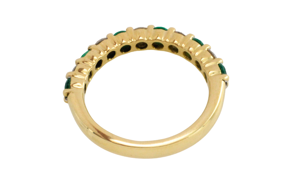 Emerald and diamond band in 18 carat gold