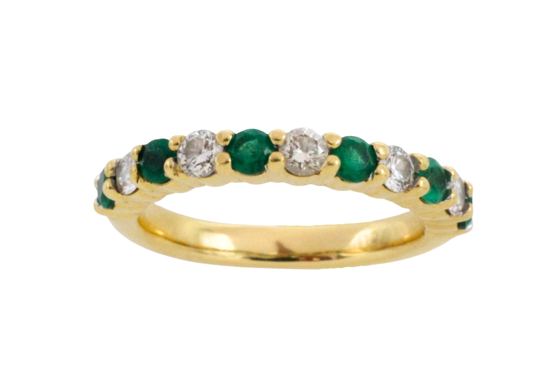Emerald and diamond band in 18 carat gold