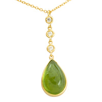 Peridot and diamnd pendant in 18 carat gold