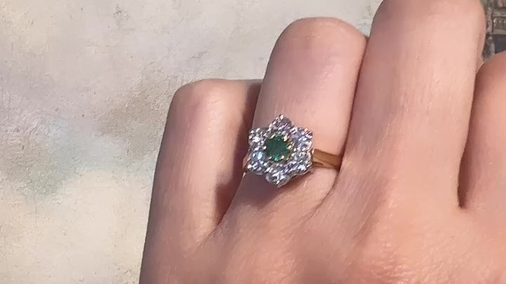 Emerald and diamond cluster ring in 18 carat gold