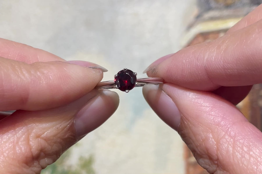 Garnet solitaire ring in white gold