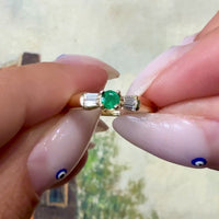 Emerald and baguette diamond ring in 18 carat gold