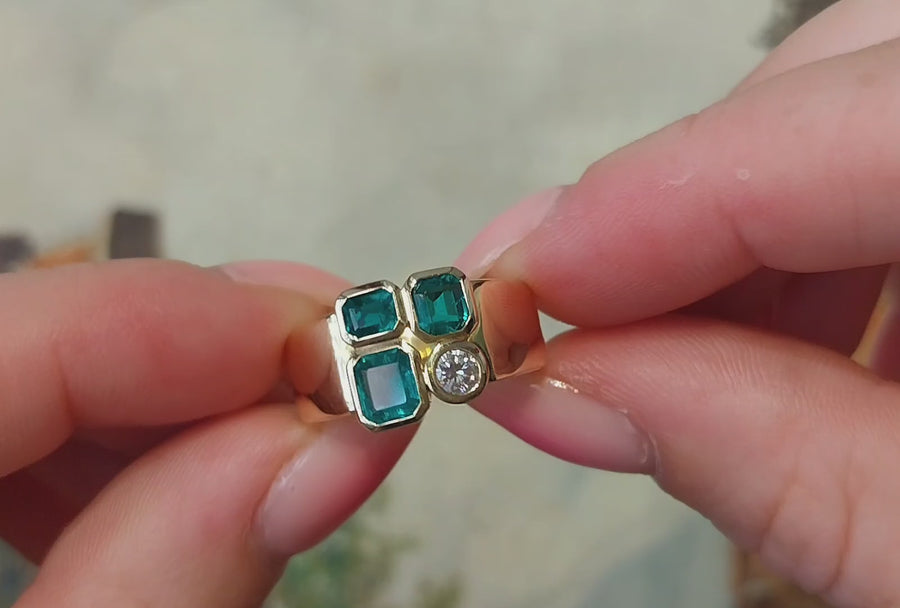 Emerald and diamond ring in 18 carat gold