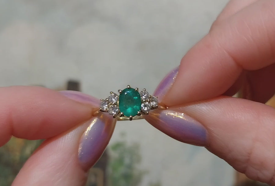 Emerald and diamond ring in 18 carat gold