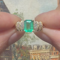 Emerald and baguette cut diamond ring in 18 carat gold