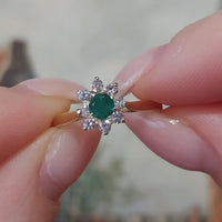Emerald and diamond cluster ring