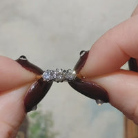 A vintage three stone ring in 18 carat gold